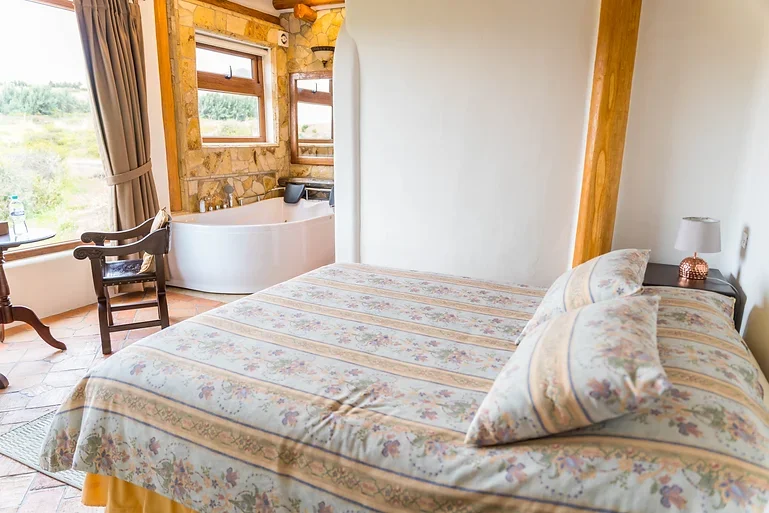 Double Suite with jacuzzi and Cotopaxi | Hacienda Los Mortiños